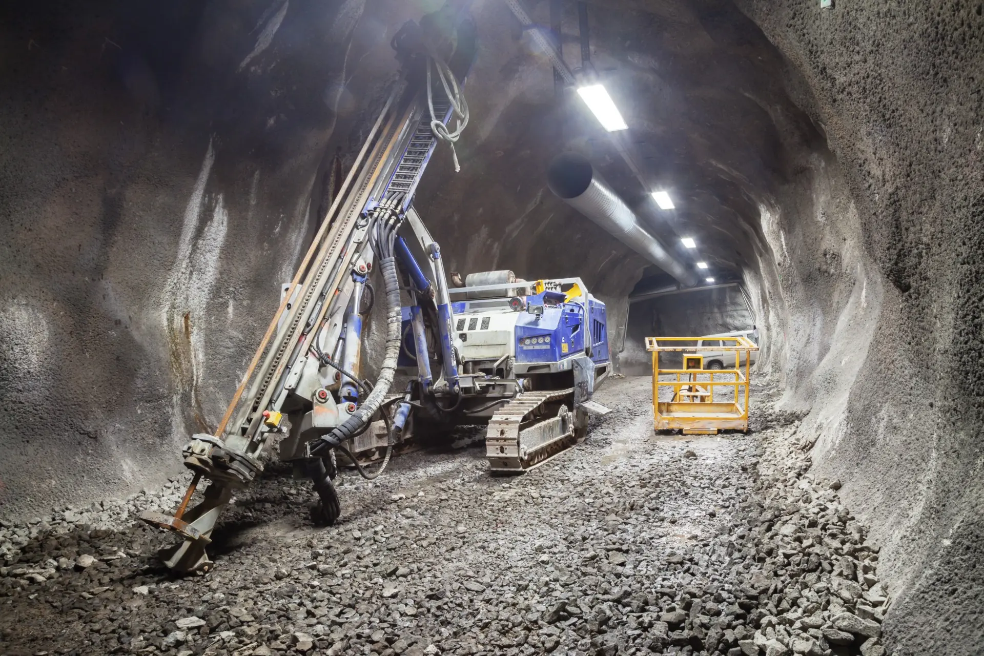 Underground drilling equipment beneath ventilation ducting.
